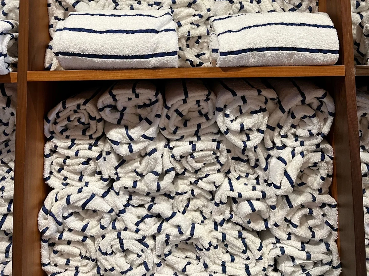 Quick-dry towels hanging with space for airflow in a shared bathroom